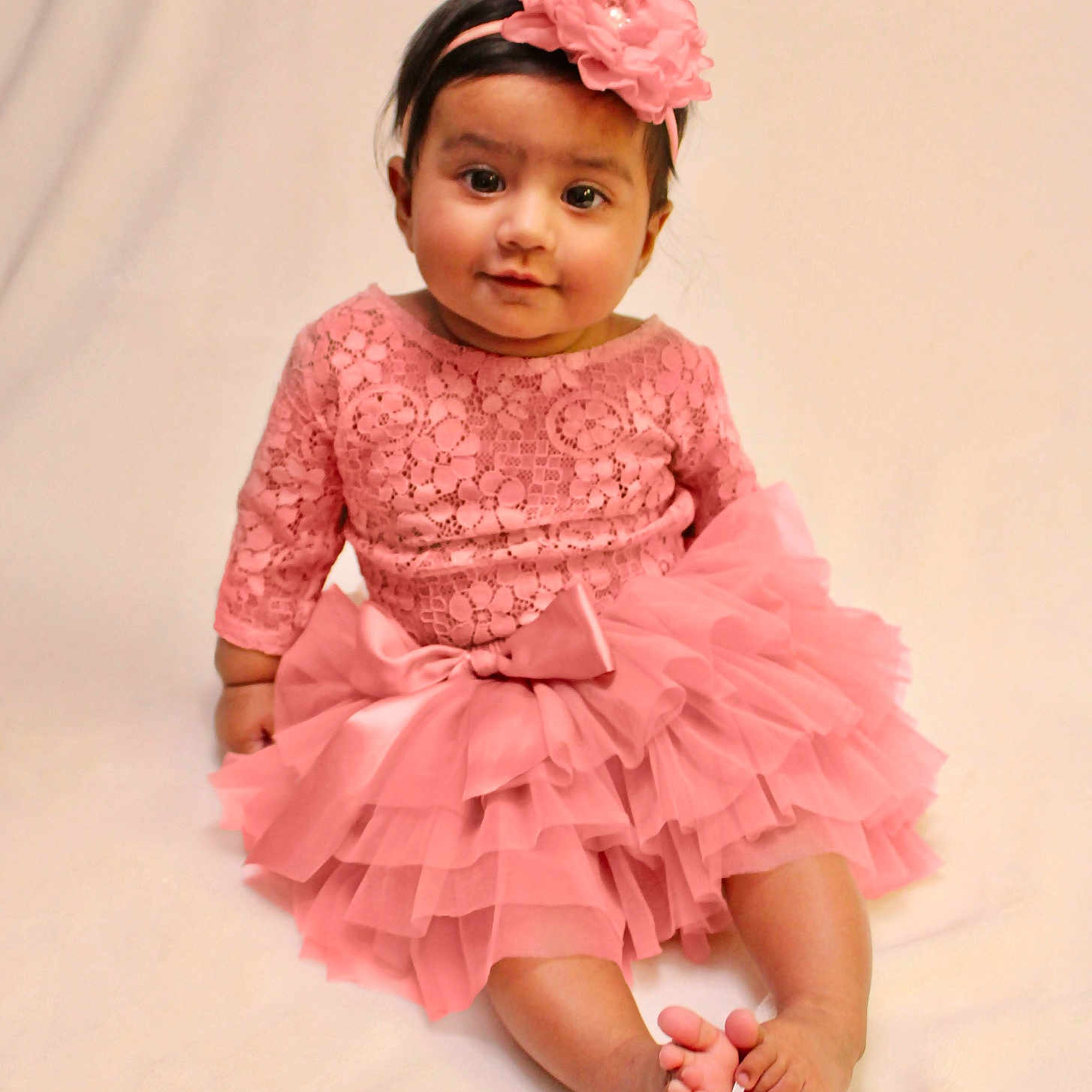 Arya joined the competition — help win amazing prizes! adorable, baby, barefoot, child, cute, fashion, flower, happy, headband, indoors, infant, lace, one_person, pink_dress, portrait, sitting, smile, soft_background, tutu, young_child