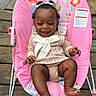 Azani is registered to the contest to win money with this photo: baby, baby_chair, bow, child, clothing, cute, feet, flowers, hands, happy, infant, outdoor, person, pink, playful, portrait, sitting, smiling, unicorn, wooden_deck