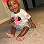 baby, bow, carpet, child, cute, earrings, foot, hand, happy, headband, indoors, minnie_mouse, person, portrait, shorts, sitting, skin, smiling, tshirt, young
