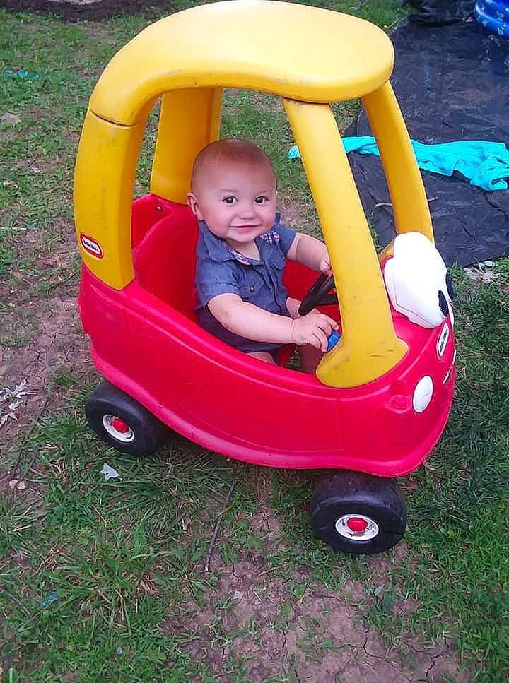 Brayden is registered to the contest to win money with this photo: baby_products, baby_toys, child, fun, joy, leisure, person, play, product, riding_toy, toddler, toy, vehicle, yellow