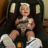 baby, car_seat, child, smile, headband, sneakers, seatbelt, infant, happy, indoor, cute, sitting, clothing, footwear, person, safety, car_safety, baby_girl, accessory, portrait