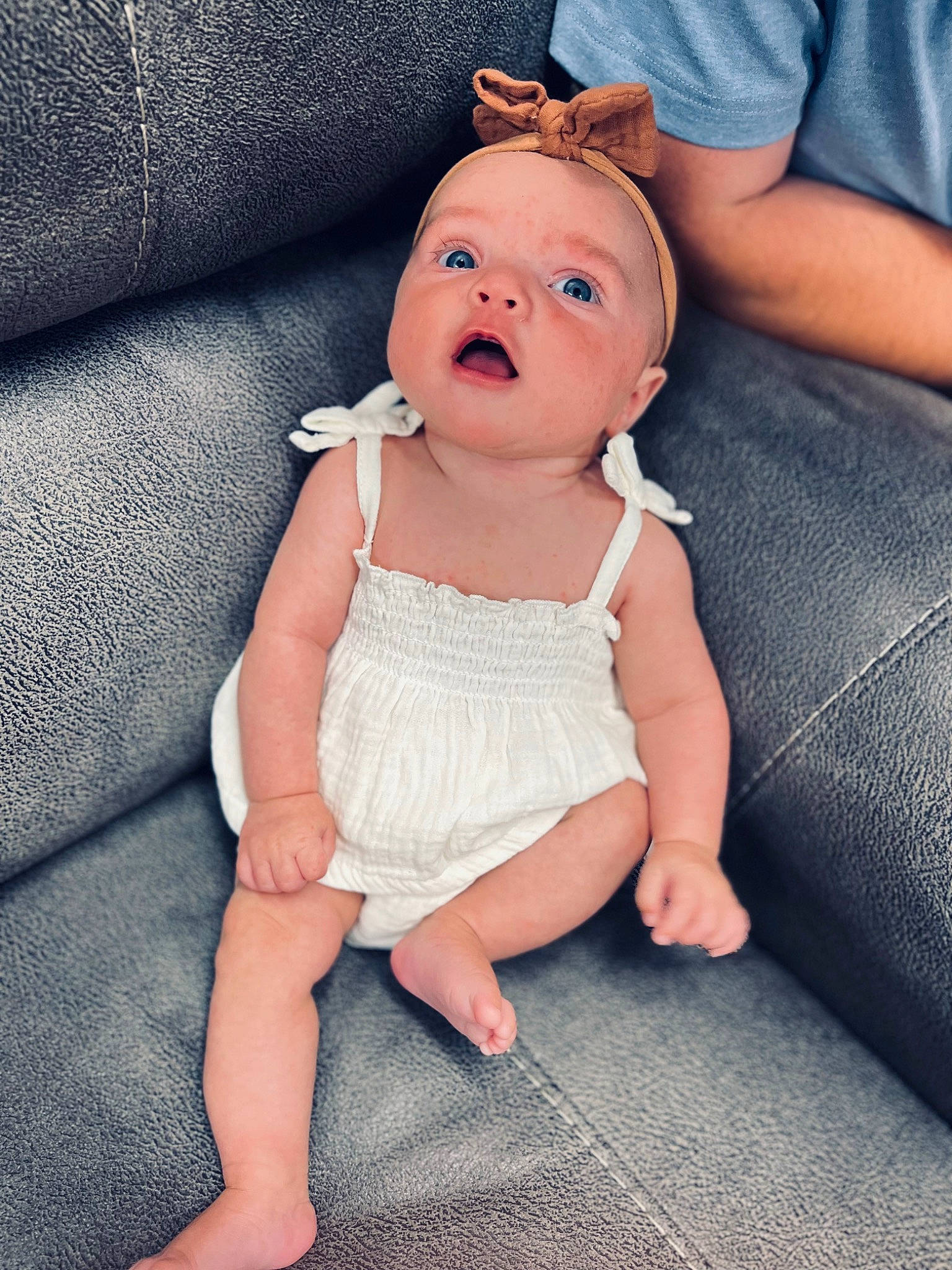 Kinlee is registered to the contest to win money with this photo: baby, baby_toddler_clothing, blue, cheek, child, clothing, comfort, eye, eyelash, finger, foot, hand, happy, hat, joint, leg, person, skin, sleeve, thumb