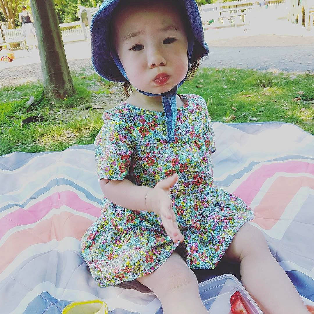 Raicheal joined the competition — help win amazing prizes! baby_toddler_clothing, child, dress, face, facial_expression, grass, happy, hat, leisure, lip, people_in_nature, person, photograph, pink, plant, recreation, skin, sleeve, summer, toddler