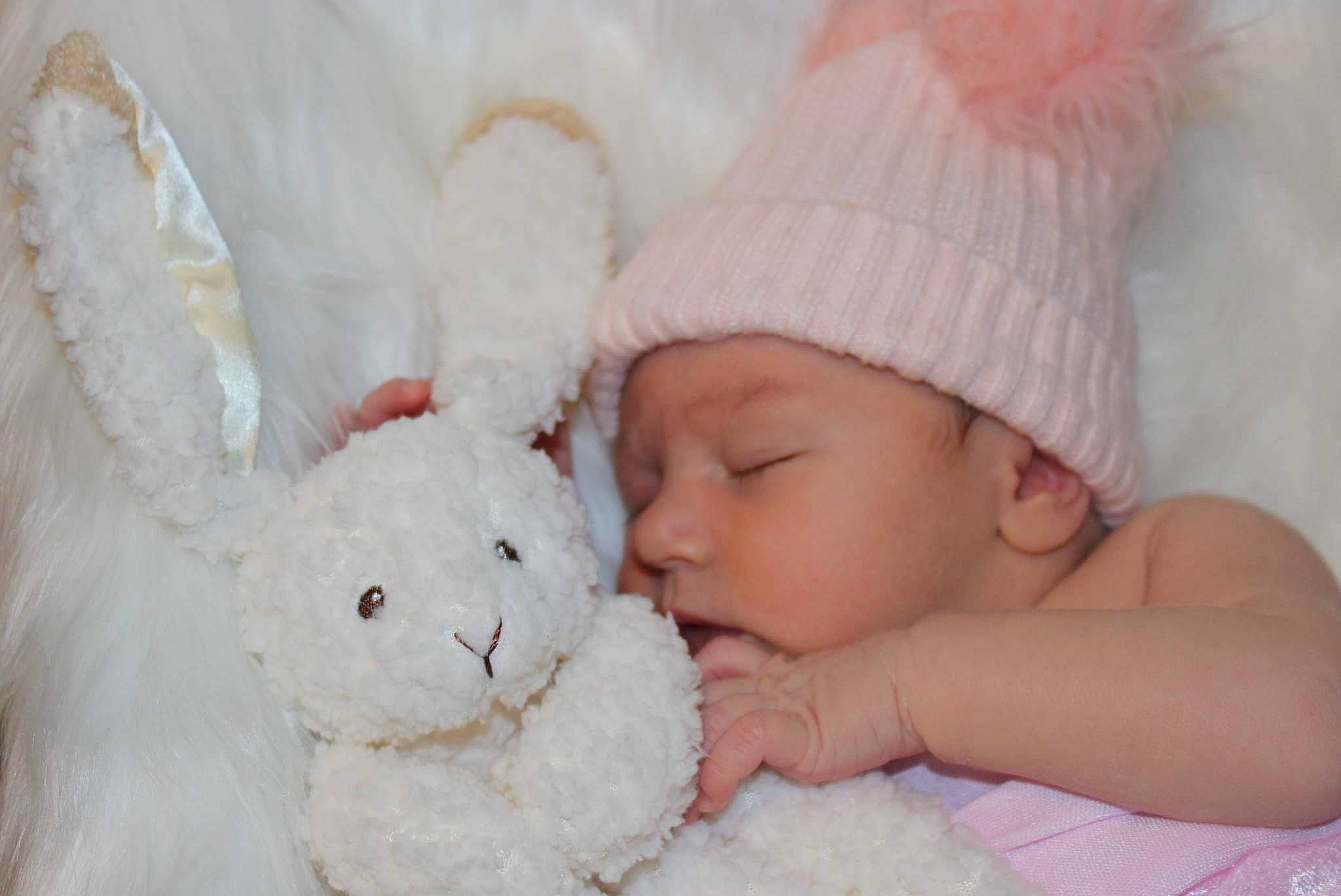 Kensleigh joined the competition — help win amazing prizes! baby, baby_sleeping, baby_toddler_clothing, cap, cheek, child, comfort, ear, eye, finger, hand, happy, head, headwear, nose, person, pink, rabbit, skin, textile