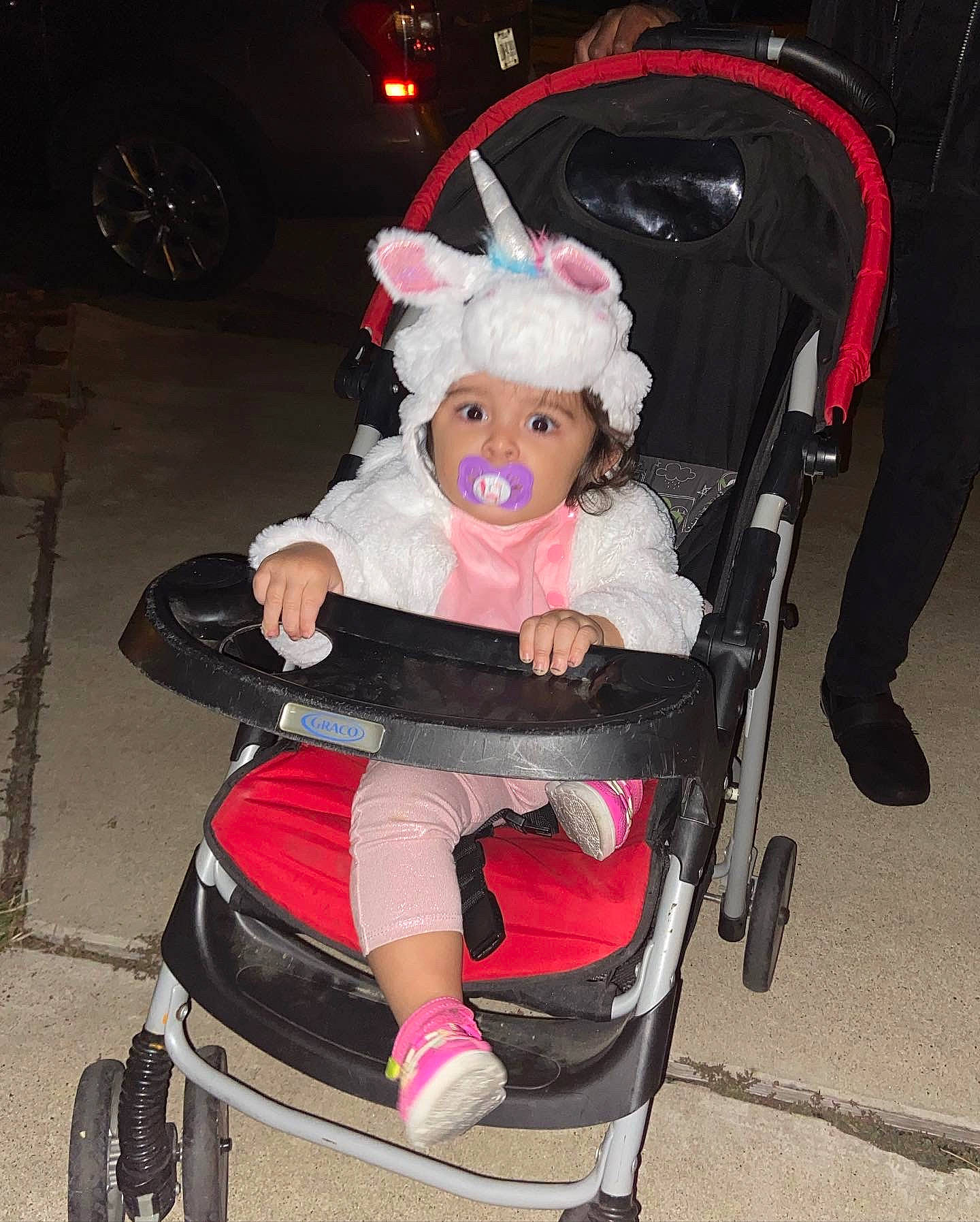 Elianna joined the competition — help win amazing prizes! baby, baby_carriage, baby_products, chair, child, doll, event, fashion_accessory, fun, fur, headwear, lap, magenta, person, pink, product, sitting, smile, tire, toy