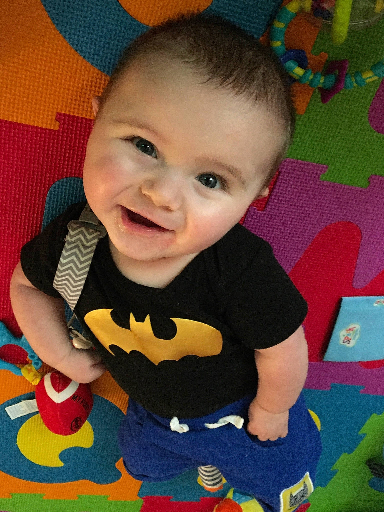Brenton is registered to the contest to win money with this photo: baby, baby_toddler_clothing, baby_toys, cheek, child, ear, eye, face, facial_expression, fun, happy, head, lip, person, play, sitting, skin, smile, toddler, tummy_time
