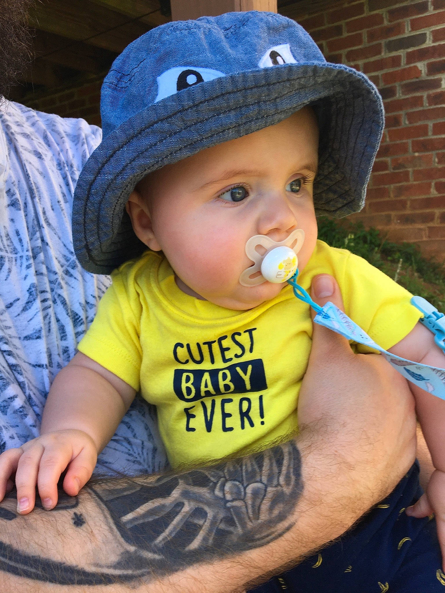 Brenton is registered to the contest to win money with this photo: baby, baby_toddler_clothing, child, cool, fashion_accessory, hat, headgear, headwear, person, sleeve, smile, sun_hat, toddler, yellow