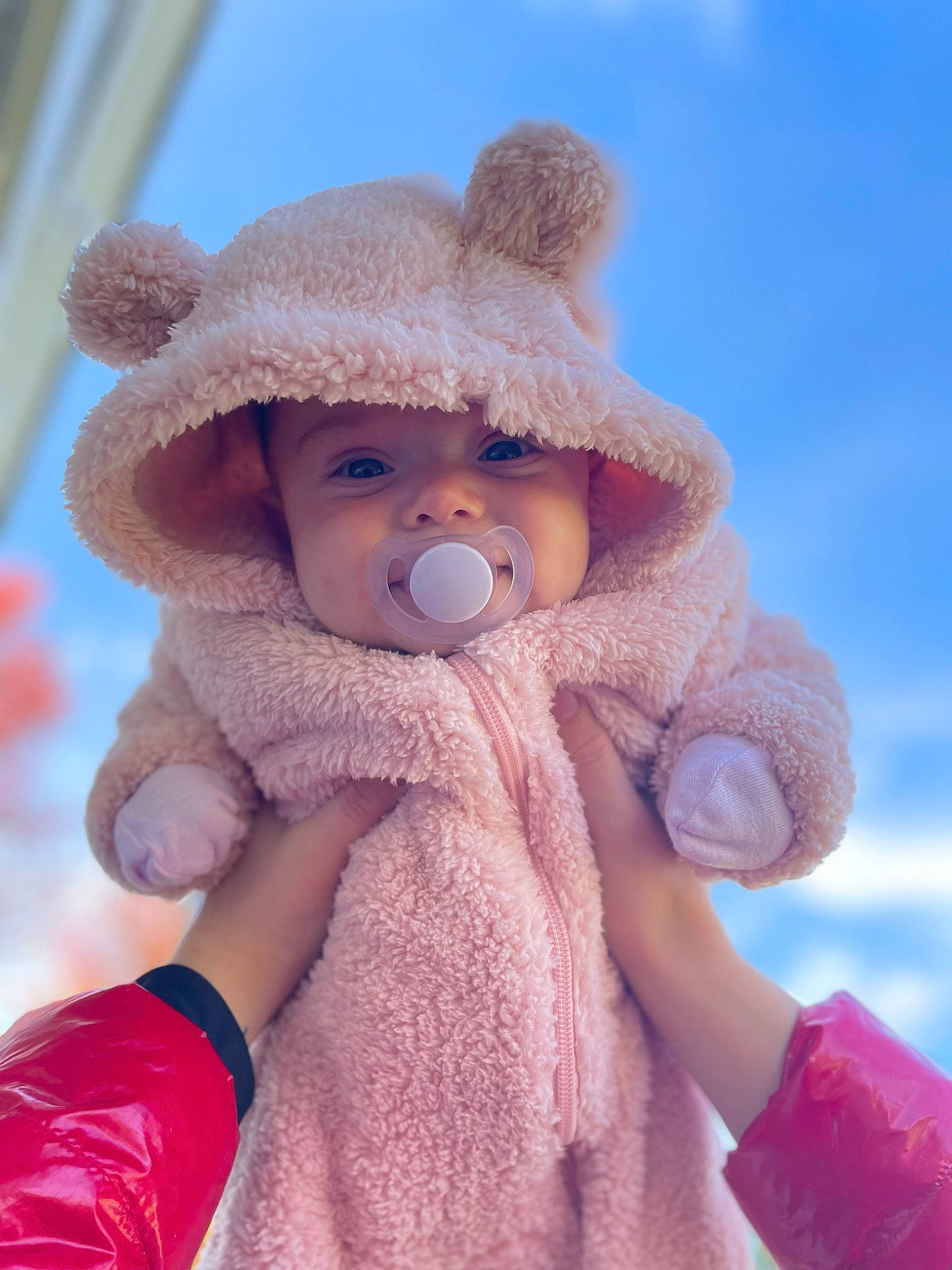 Journii is registered to the contest to win money with this photo: baby, baby_toddler_clothing, cap, cheek, doll, dress, eye, face, gesture, happy, head, headgear, headwear, lip, nose, person, pink, skin, sky, sleeve