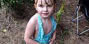Renesmee joined the competition — help win amazing prizes! child, girl, swimsuit, barefoot, outdoor, garden, plants, dirt, greenery, summer, young, cute, standing, looking_up, nature, casual, playful, blue, hair_ties, chair
