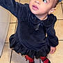 Adhara is registered to the contest to win money with this photo: black_dress, black_shoes, child, curly_hair, cute, earring, fashion, floor_tiles, hair_bow, indoor, long_sleeves, looking_up, person, portrait, reaching_hand, red_tights, standing, tile_floor, toddler, young_child