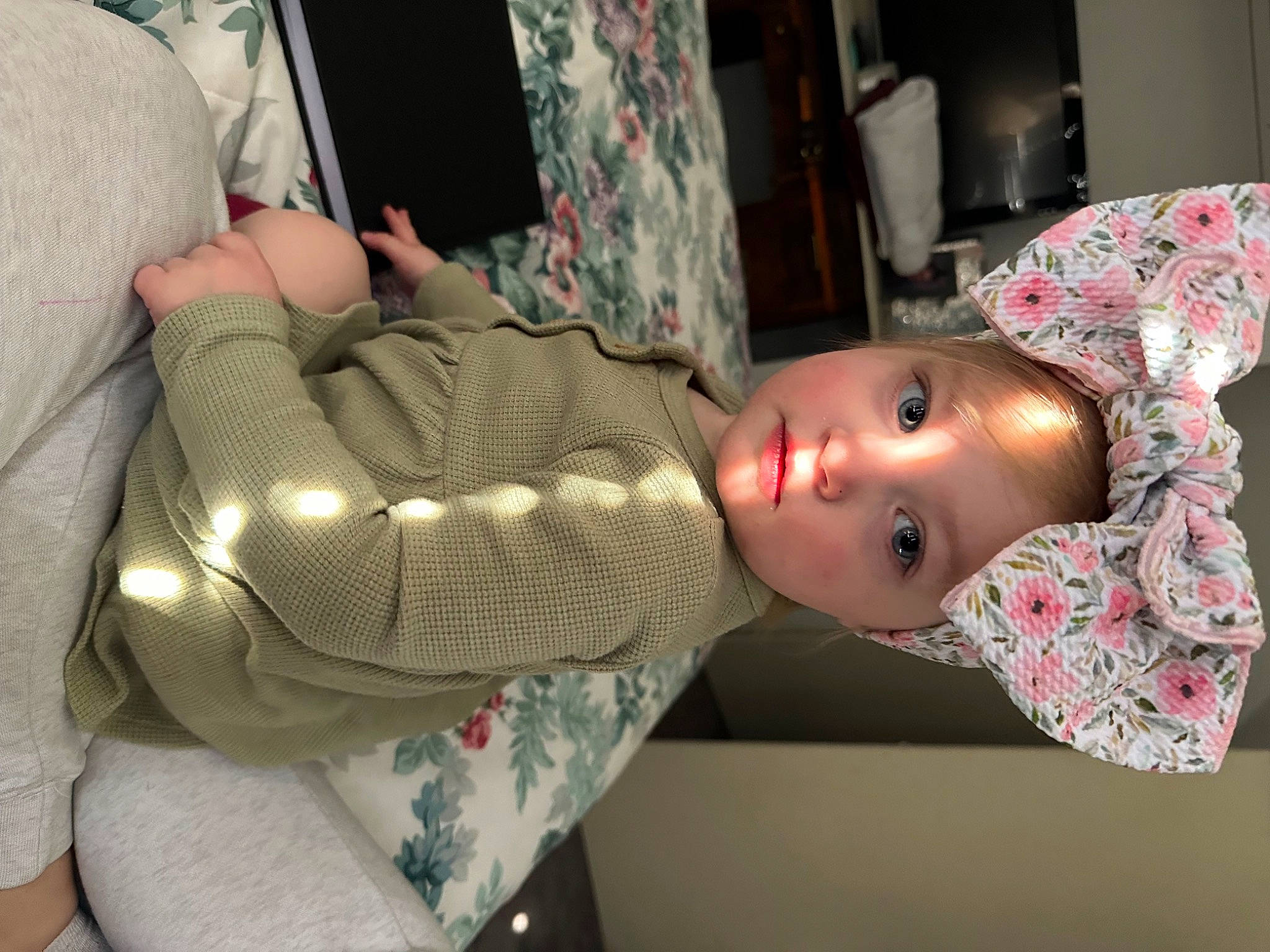Parklynn is registered to the contest to win money with this photo: auto_part, baby, bag, car_seat, chair, chest, child, comfort, fun, hat, headwear, helmet, human_leg, pattern, person, personal_protective_equipment, room, sitting, toddler, toy