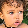child, toddler, curly_hair, face, necklace, beads, skin, outdoor, portrait, expression, eyes, mouth, shoulders, young, cute, person, natural_light, closeup, head, curly