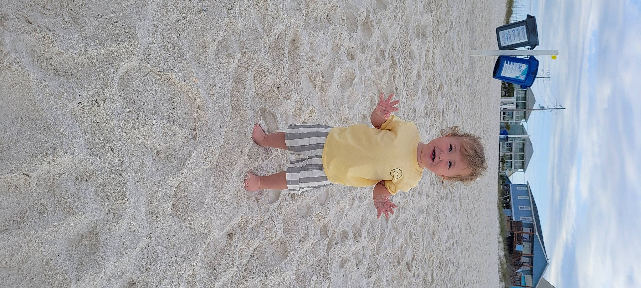 Lucas is registered to the contest to win money with this photo: baby, baby_products, baby_toddler_clothing, beach, child, finger, foot, fun, gesture, hand, human_leg, pattern, person, sand, shadow, skin, textile, toddler, tree, vacation