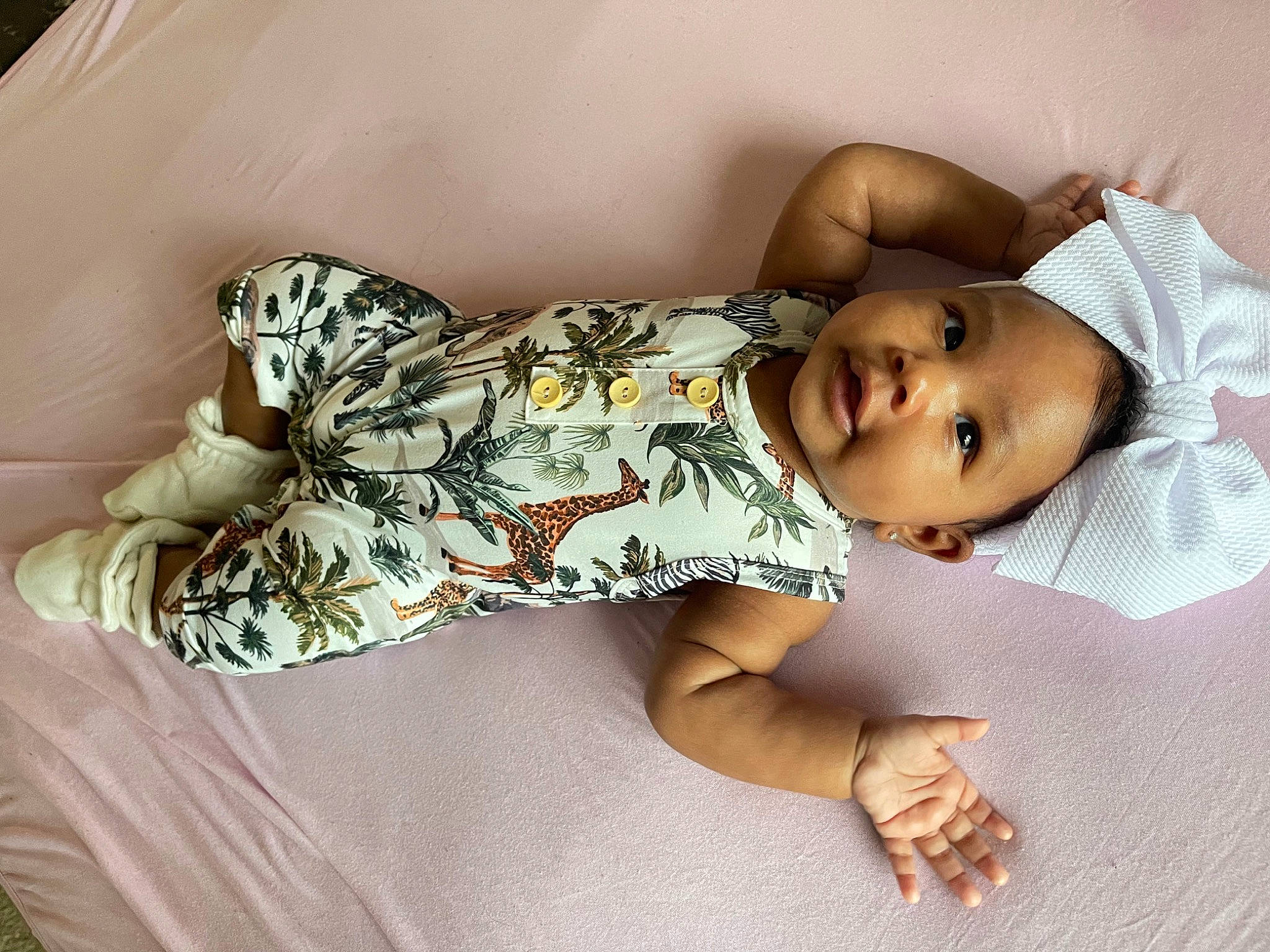 Morgan is registered to the contest to win money with this photo: arm, baby, baby_toddler_clothing, comfort, elbow, finger, glasses, hand, happy, hat, human_body, joint, leg, mammal, person, skin, sleeve, smile, textile, thigh