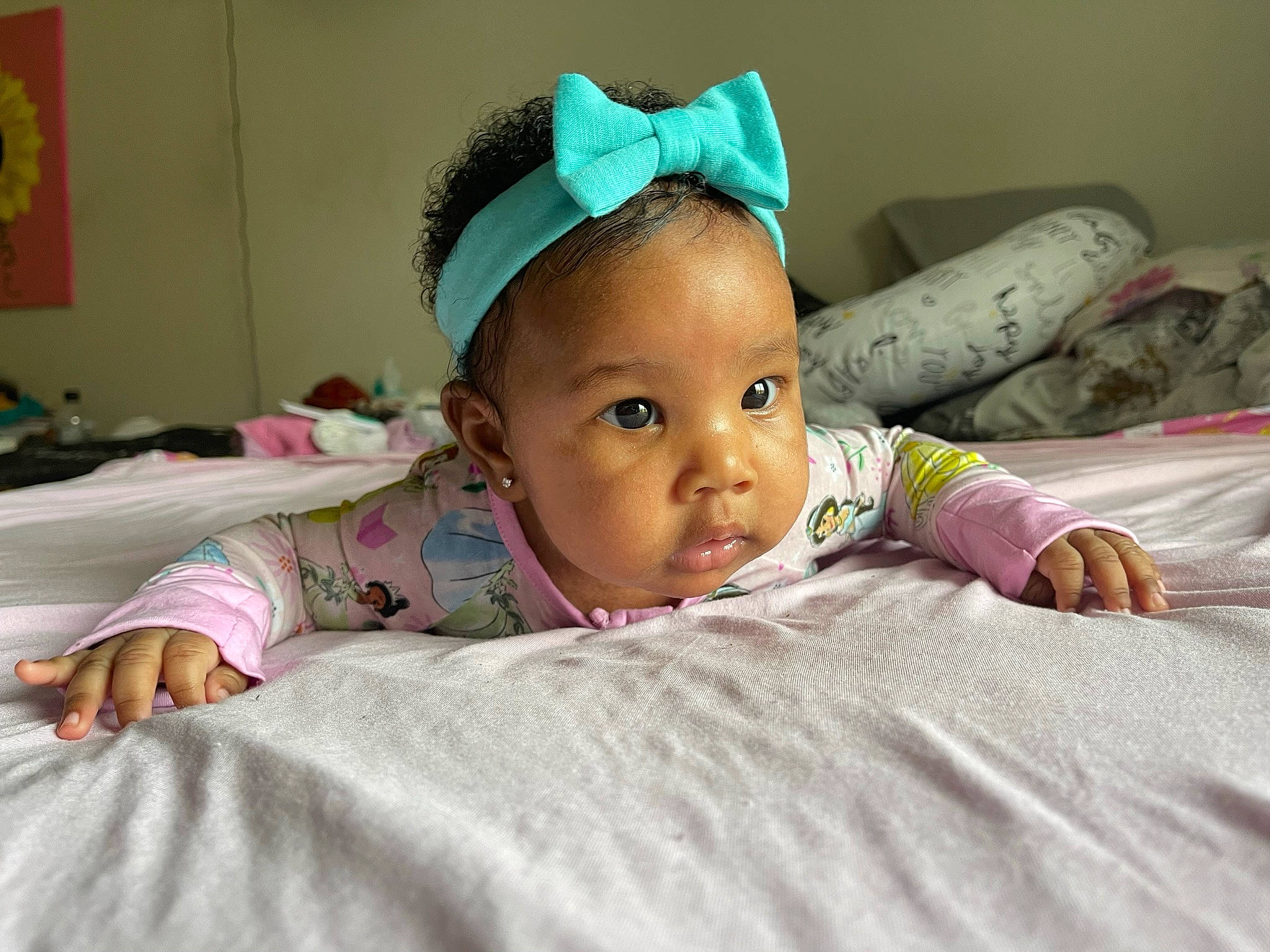 Morgan is registered to the contest to win money with this photo: baby, bed, bedding, bedtime, cheek, child, comfort, event, eyebrow, fun, hair_accessory, happy, headband, headpiece, iris, linens, person, room, skin, smile