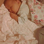 Sarah is registered to the contest to win money with this photo: baby, bedroom, blanket, child, clothing, comfort, cozy, cute, floral_pattern, hand, infant, minnie_mouse, newborn, peaceful, pink, portrait, rest, sleeping, soft_texture, toddler