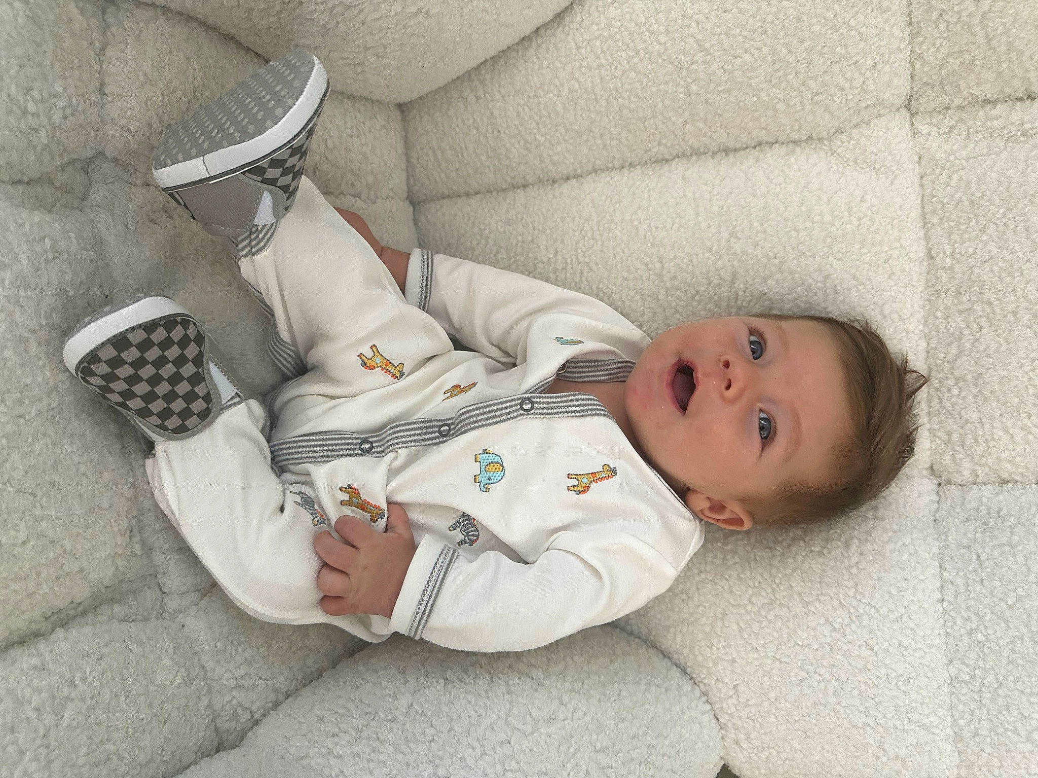 Harrison is registered to the contest to win money with this photo: baby, baby_products, baby_sleeping, baby_toddler_clothing, child, collar, comfort, couch, elbow, hat, linens, nap, pattern, person, room, sitting, sleep, sleeve, smile, toddler