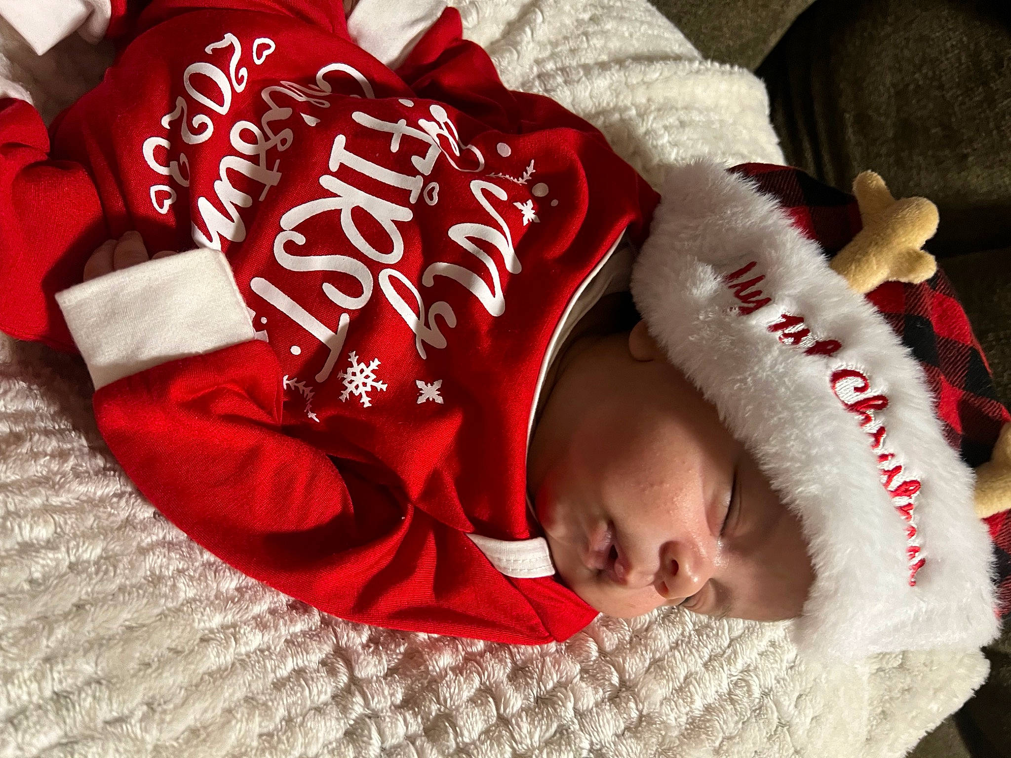 Karter is registered to the contest to win money with this photo: baby, baby_products, baby_sleeping, baby_toddler_clothing, carmine, child, comfort, font, fur, happy, headwear, linens, person, red, sleeve, toddler
