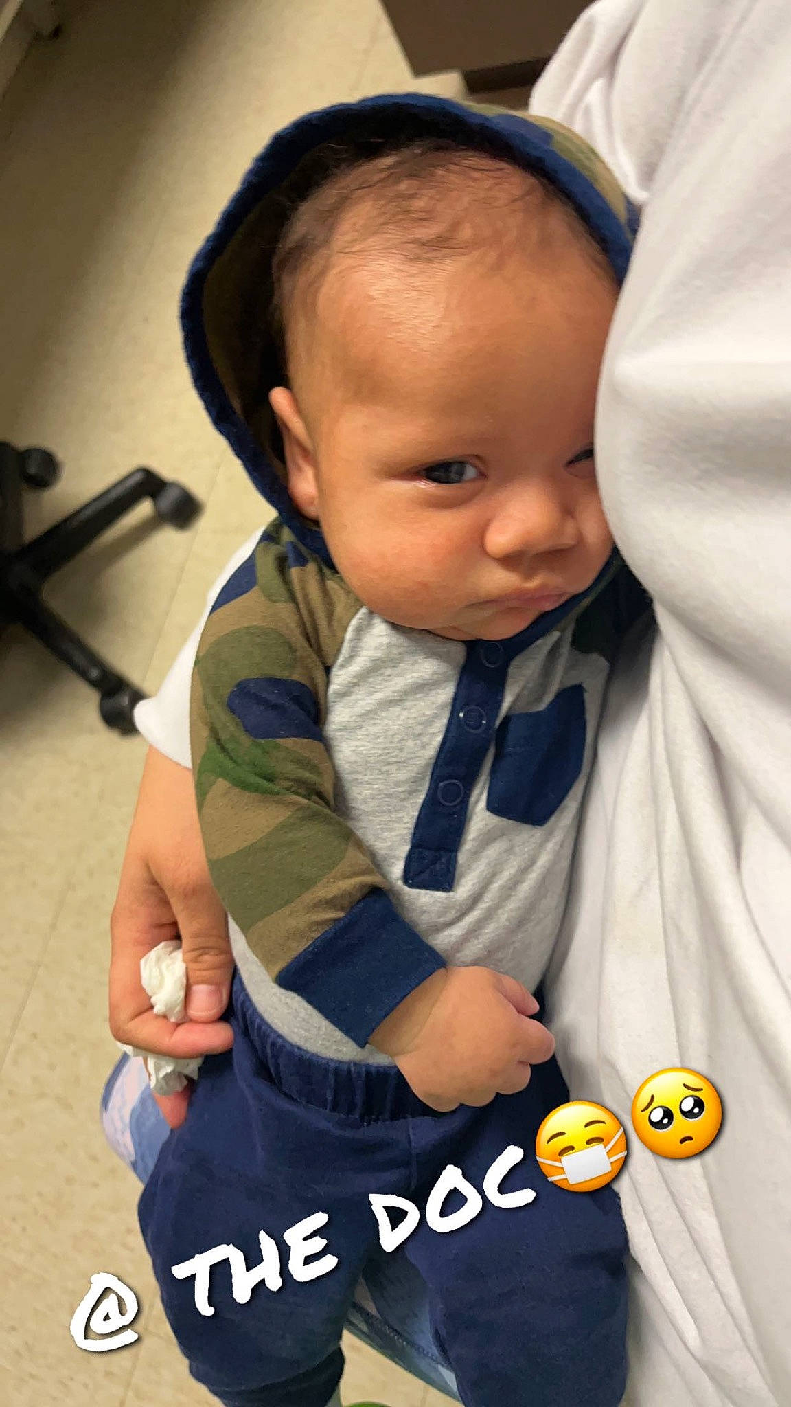 Andrew is registered to the contest to win money with this photo: arm, baby, baby_carriage, baby_products, baby_toddler_clothing, cheek, child, cool, finger, gesture, hand, happy, nose, person, product, sitting, skin, sleeve, t_shirt, thumb