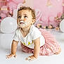 toddler, child, baby, cake, frosting, pink_tutu, white_shirt, crawling, birthday, party, balloons, curly_hair, messy, cute, celebration, indoor, portrait, smudged_face, happy, curious
