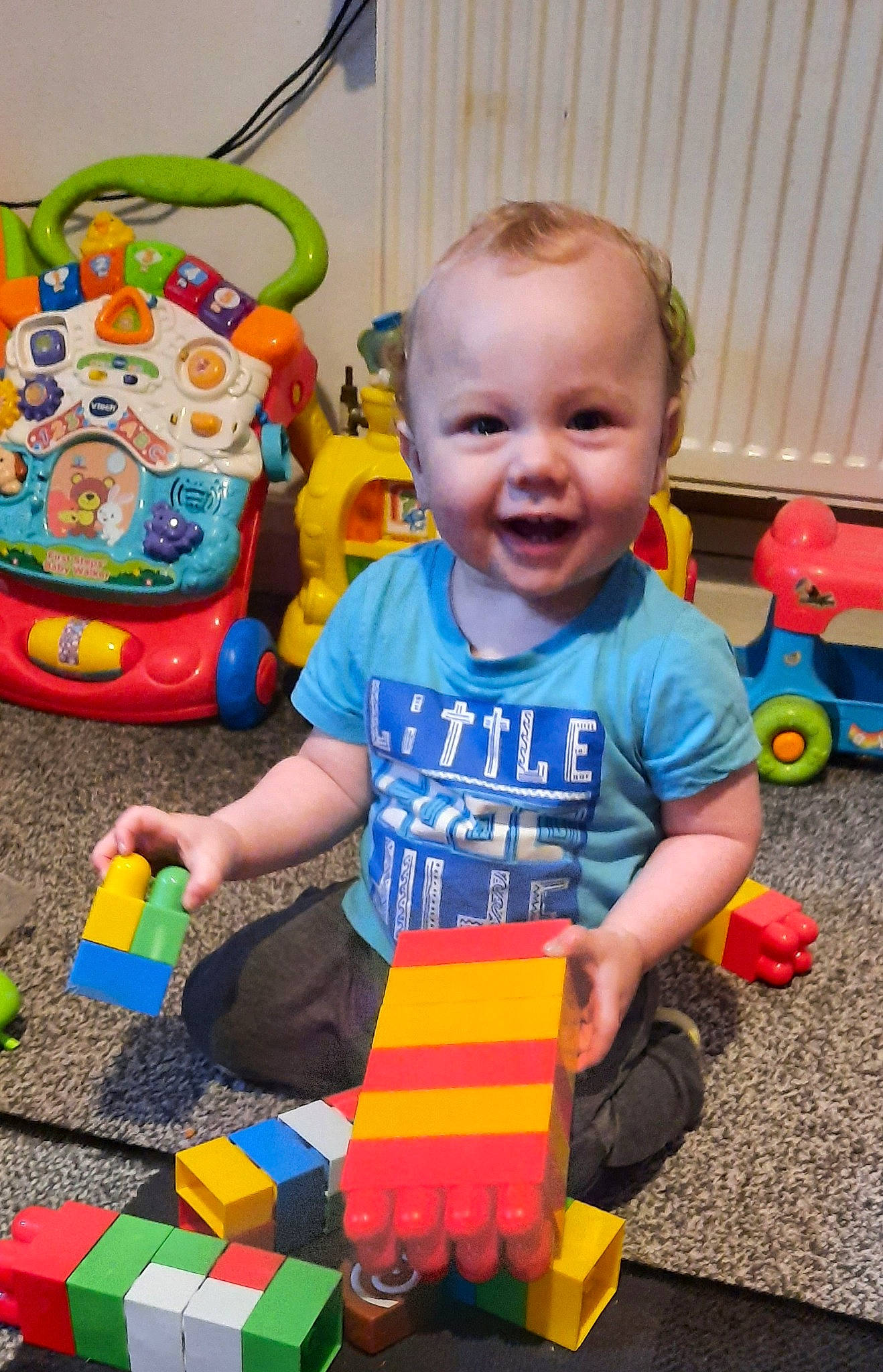 Teddy is registered to the contest to win money with this photo: baby_playing_with_toys, baby_toys, child, fun, lego, person, play, playset, toddler, toy, toy_block
