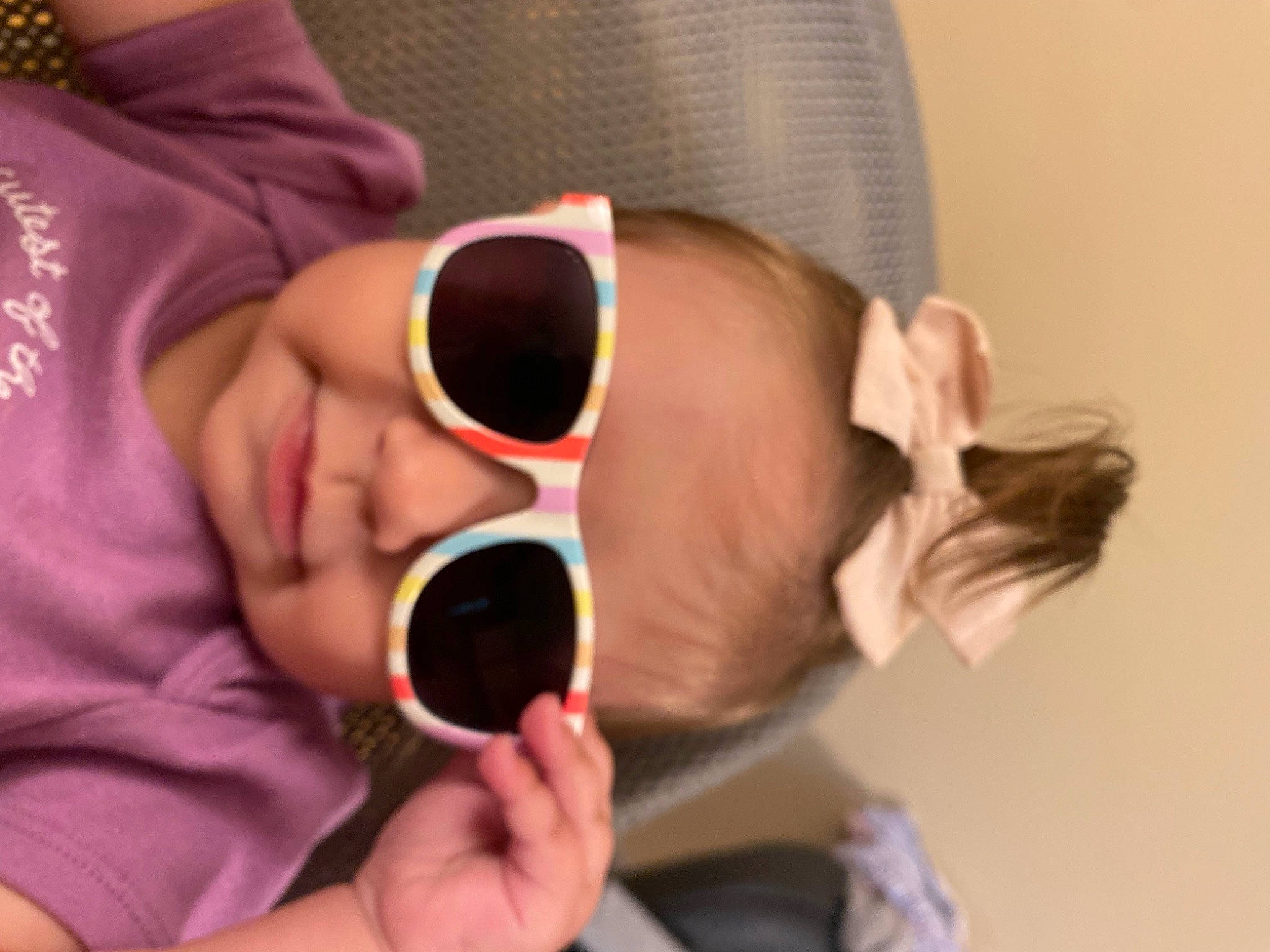 Marin is registered to the contest to win money with this photo: baby, cheek, comfort, ear, eyebrow, eyelash, eyewear, finger, gesture, glasses, goggles, hand, hearing, human_body, mouth, neck, nose, person, skin, sunglasses