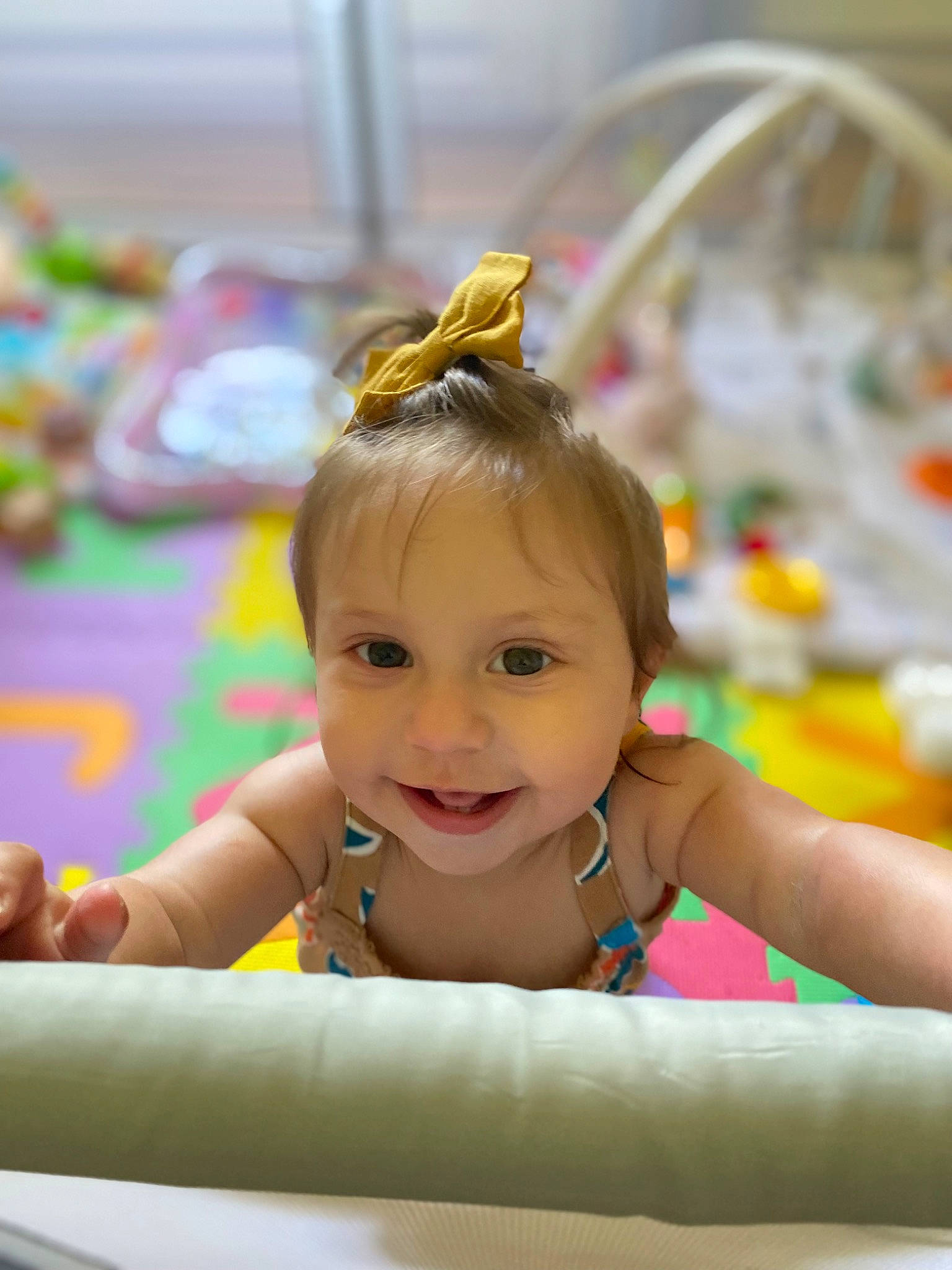 Marin is registered to the contest to win money with this photo: baby, baby_playing_with_toys, baby_toddler_clothing, bathing, child, event, fashion_accessory, fun, hair_accessory, happy, headpiece, iris, joy, leisure, person, recreation, room, sitting, skin, smile