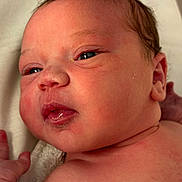 Millie-Rose is registered to the contest to win money with this photo: baby, child, closeup, cute, eyes, face, hand, human, indoors, infant, lying_down, newborn, newborn_baby, person, portrait, relaxed, skin, sleepy, soft, young