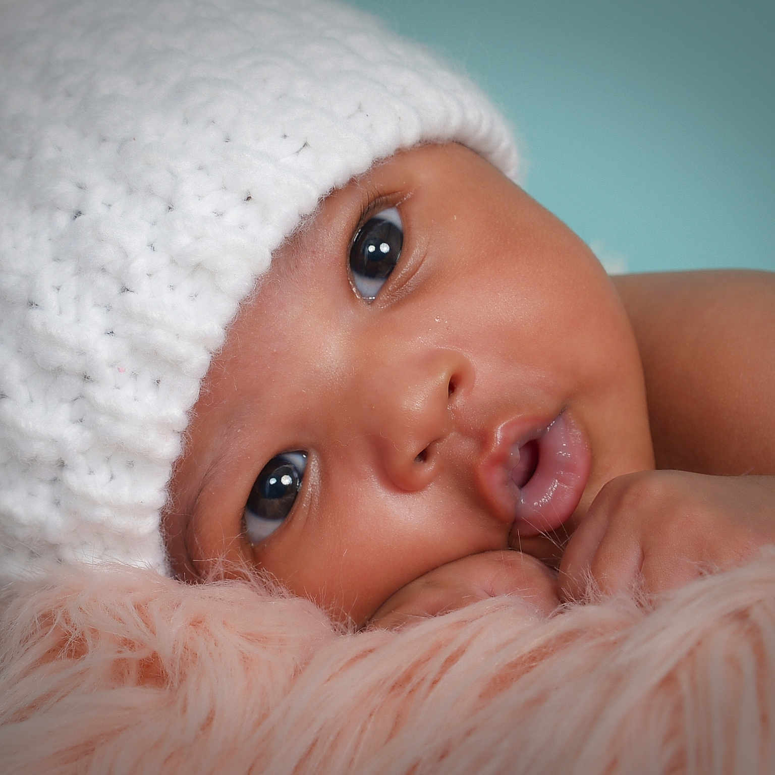 Tru Destiny is registered to the contest to win money with this photo: baby, beanie, bodypart, bonnet, cap, clothing, face, finger, hand, hat, head, mouth, newborn, person, photography, portrait