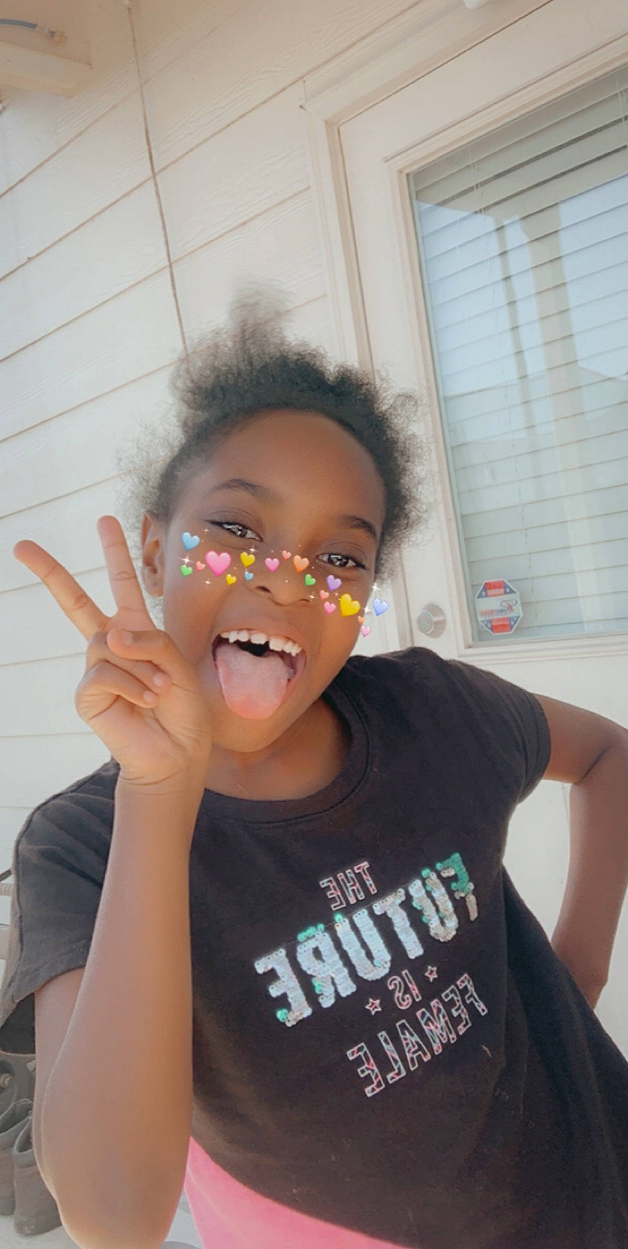 Leianna is registered to the contest to win money with this photo: child, ear, face, finger, forehead, fun, gesture, head, mouth, person, smile