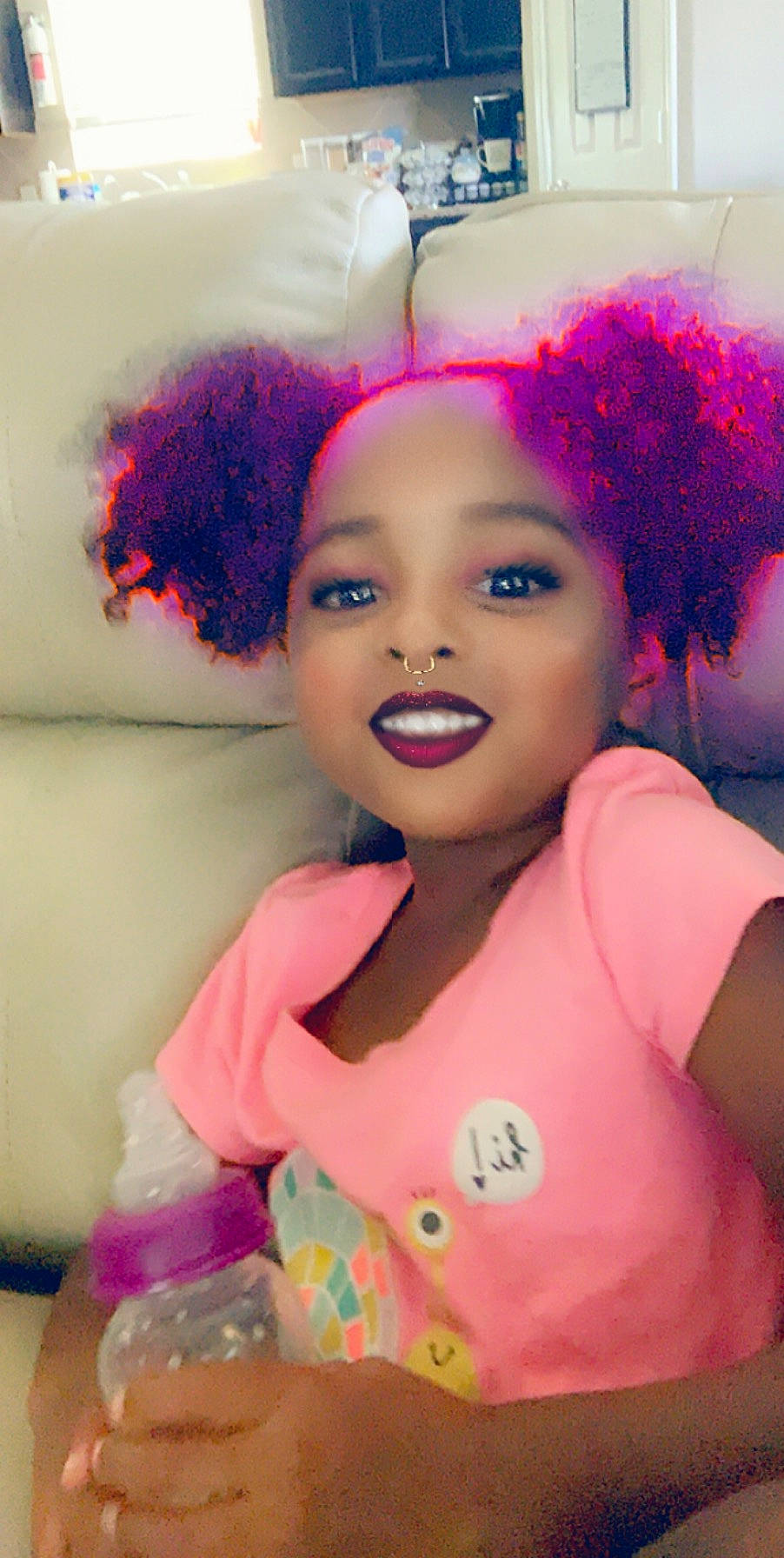 Savanna is registered to the contest to win money with this photo: afro, cheek, child, eyebrow, eyelash, face, forehead, hair, hair_accessory, hair_coloring, hairstyle, jheri_curl, lip, magenta, person, pink, smile, toddler, wig