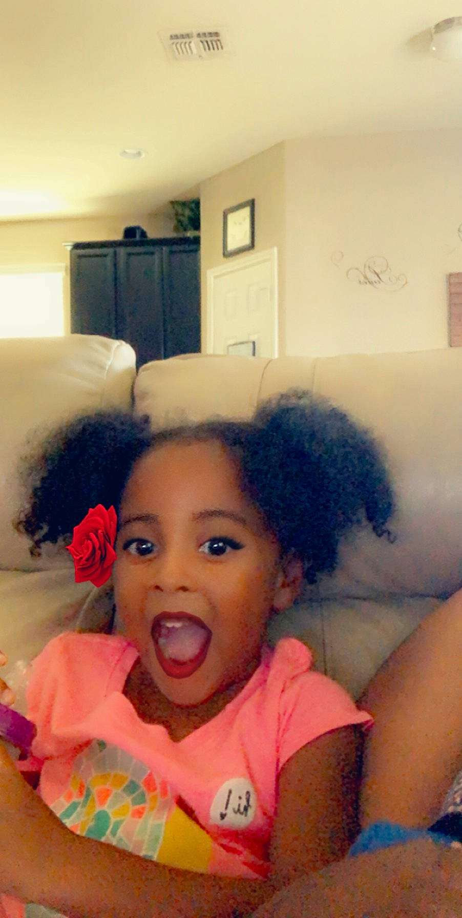 Savanna is registered to the contest to win money with this photo: afro, baby, black_hair, cheek, child, face, fun, hair, head, lip, nose, person, smile, surprise, toddler