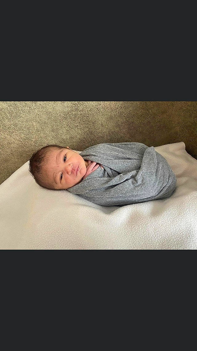Angelo joined the competition — help win amazing prizes! baby, baby_products, baby_safety, baby_sleeping, bed_sheet, bedding, bedtime, child, collar, comfort, flooring, grey, hardwood, linens, nap, person, rectangle, room, sleeve, toddler