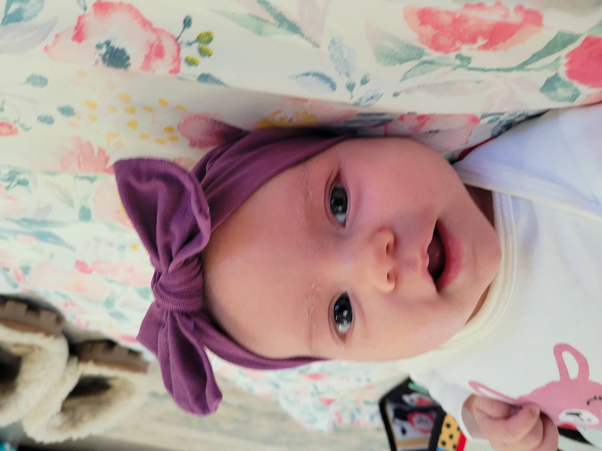 Sophie is registered to the contest to win money with this photo: baby, baby_toddler_clothing, cheek, child, eyebrow, eyelash, fashion_accessory, grass, happy, hat, headwear, iris, lip, nose, pattern, person, pink, portrait_photography, skin, smile