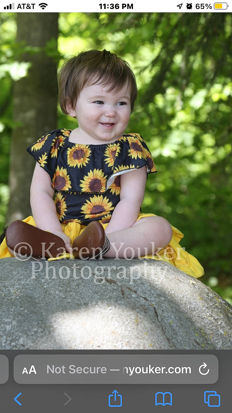 Aylin is registered to the contest to win money with this photo: baby_toddler_clothing, child, eye, face, flash_photography, fun, grass, happy, head, joy, leisure, people_in_nature, person, plant, sitting, sleeve, smile, standing, t_shirt, toddler