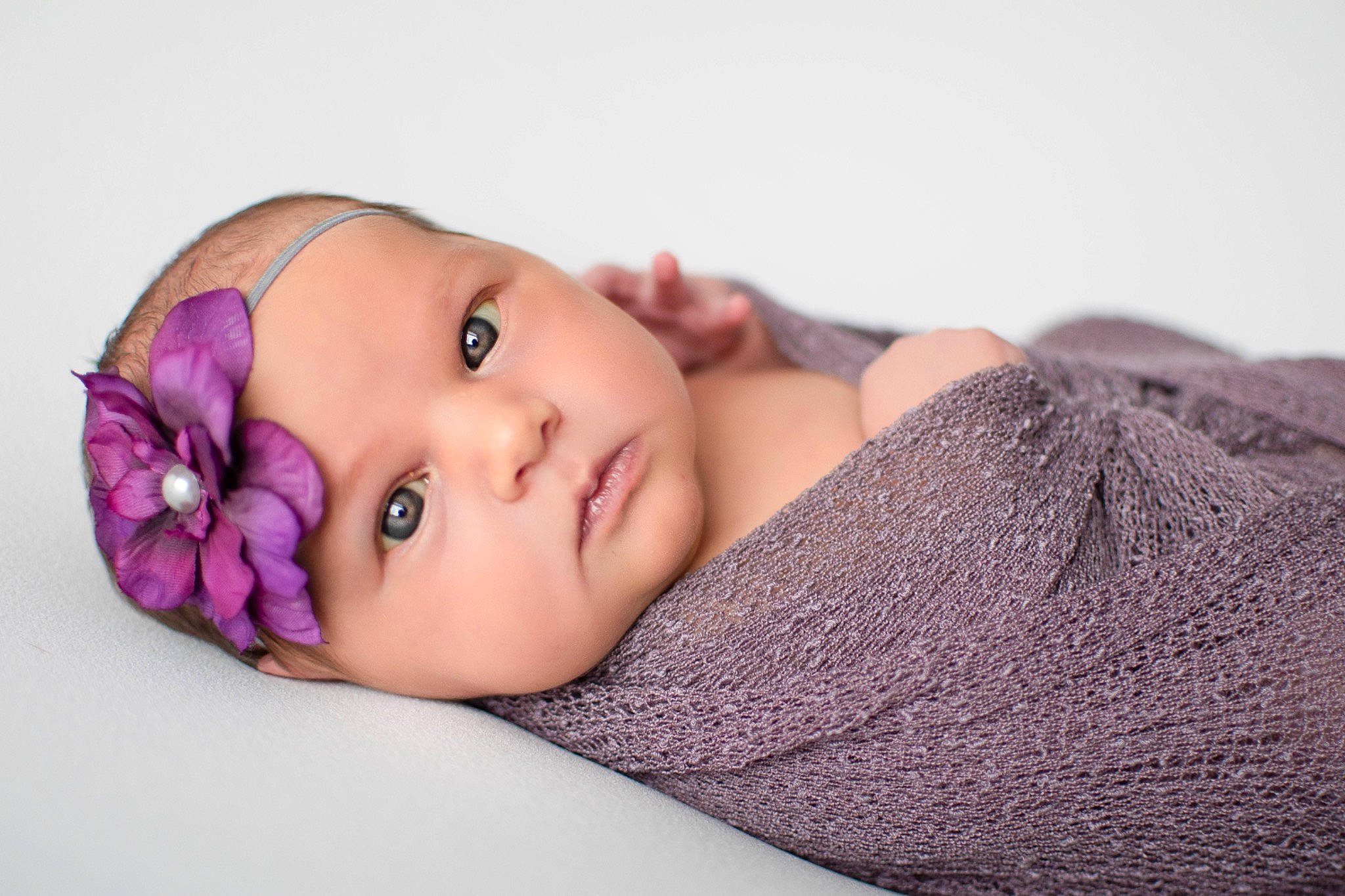 Madden joined the competition — help win amazing prizes! baby, brown_hair, cap, child, comfort, eye, eyebrow, eyelash, fashion_accessory, fur, hair_accessory, headwear, iris, knit_cap, linens, lip, magenta, pattern, person, purple