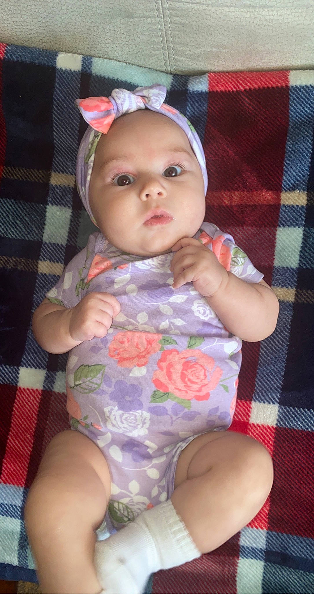 Madden is registered to the contest to win money with this photo: baby, baby_toddler_clothing, cheek, chin, comfort, eye, face, head, headwear, human_body, iris, lip, mouth, nose, person, pink, plaid, skin, sleeve, tartan