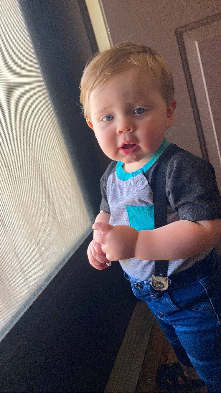 Deacon is registered to the contest to win money with this photo: arm, baby_toddler_clothing, cheek, clothing, dress_shirt, finger, flash_photography, gesture, hair, hand, happy, iris, joint, neck, person, shoulder, skin, sleeve, t_shirt, thumb