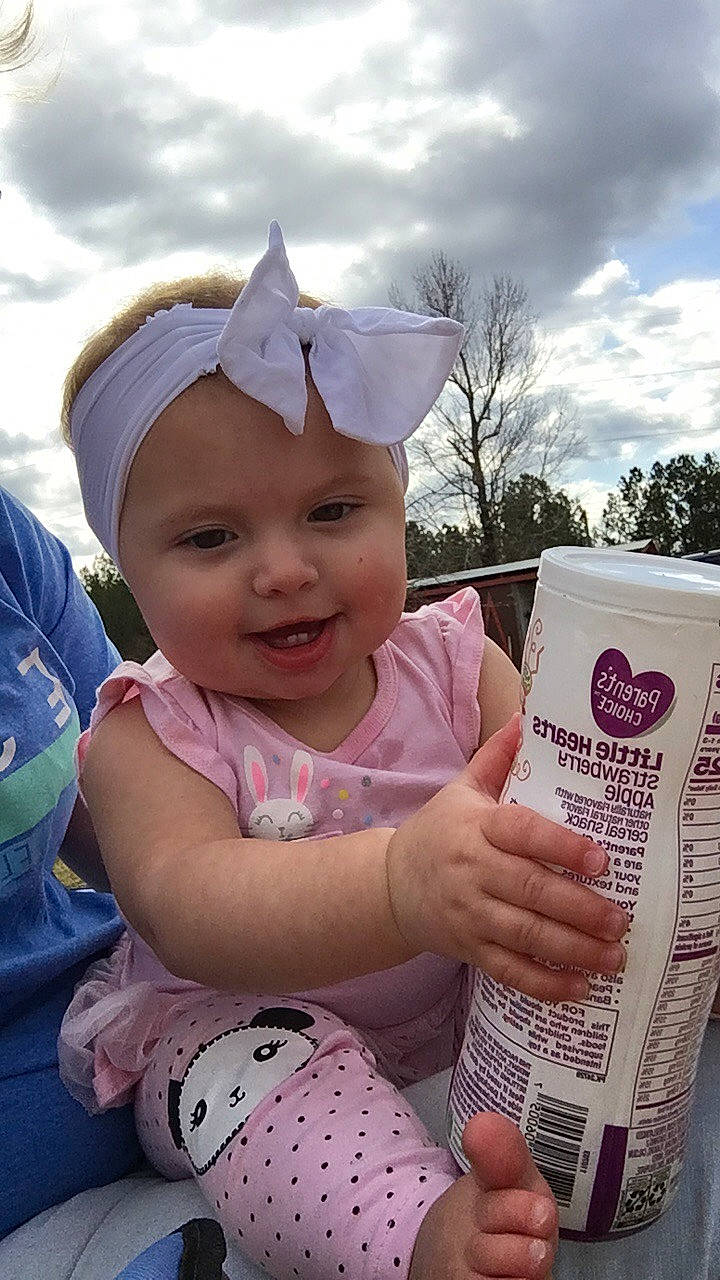 Lana joined the competition — help win amazing prizes! baby_toddler_clothing, cap, child, cloud, facial_expression, fun, grass, happy, headgear, headwear, human_body, leisure, people_in_nature, person, photograph, pink, skin, sky, smile, toddler