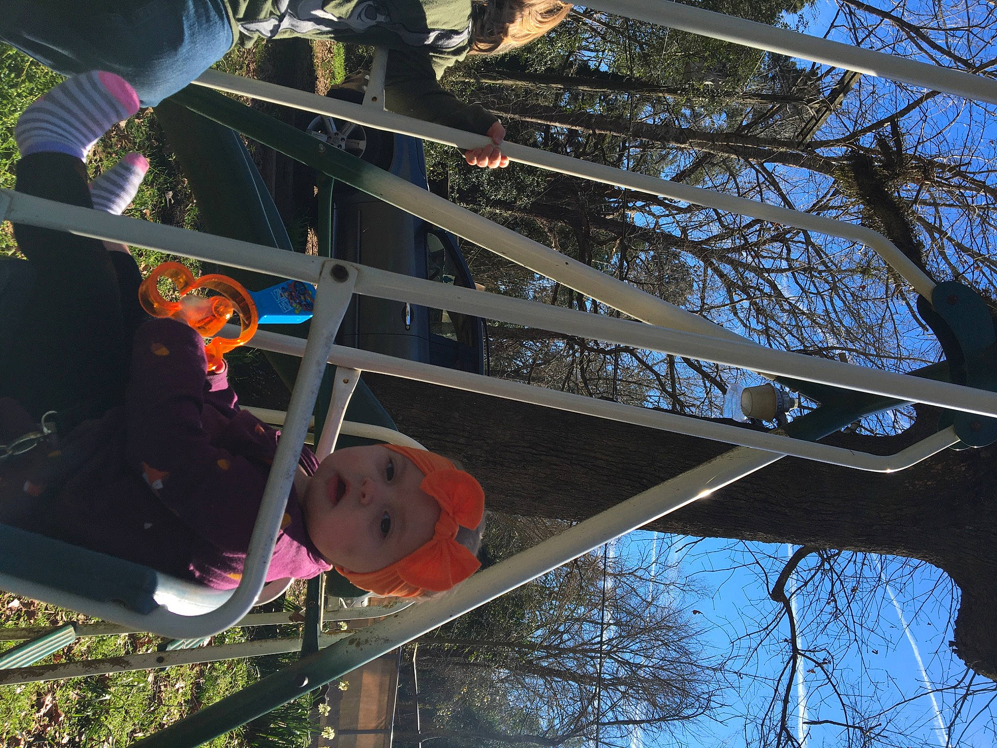 Lana joined the competition — help win amazing prizes! carmine, city, fun, headwear, leisure, line, metal, person, plant, pole, recreation, sky, street_light, tree, trunk, twig, wheel, winter, wood, world