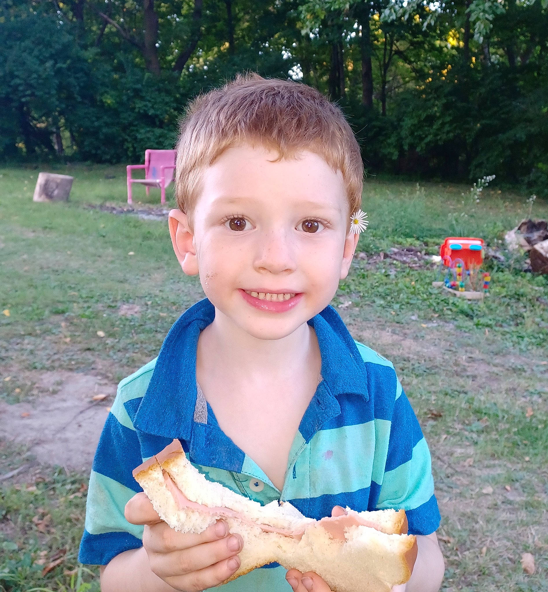 Troy is registered to the contest to win money with this photo: child, electric_blue, fish, food, fruit, fun, grass, happy, joy, leisure, people_in_nature, person, plant, play, recreation, sitting, smile, summer, thumb, toddler