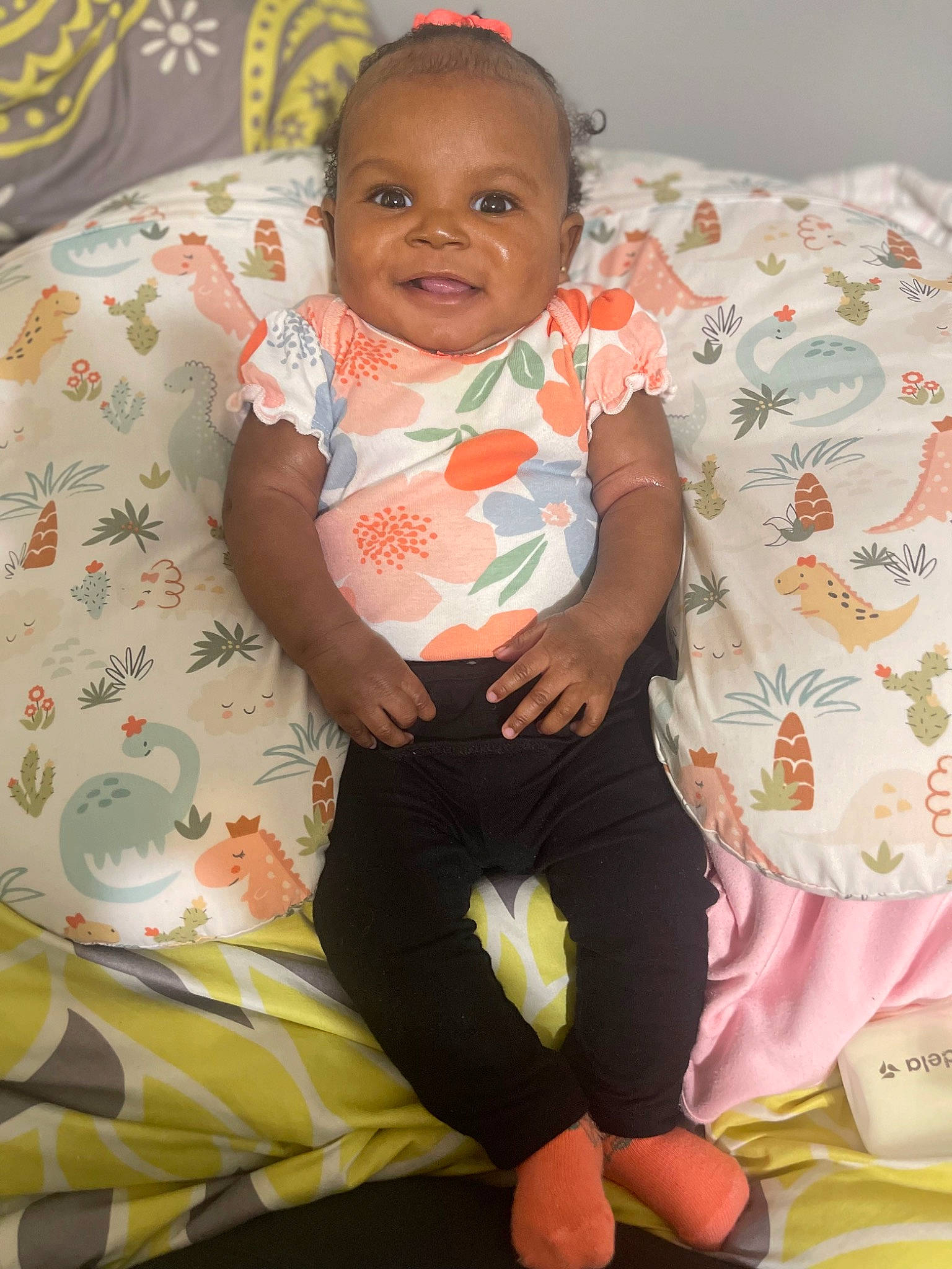 Karlie joined the competition — help win amazing prizes! baby, baby_toddler_clothing, cheek, child, comfort, eye, face, hairstyle, happy, head, joy, pattern, person, pink, sitting, skin, sleeve, smile, sock, textile