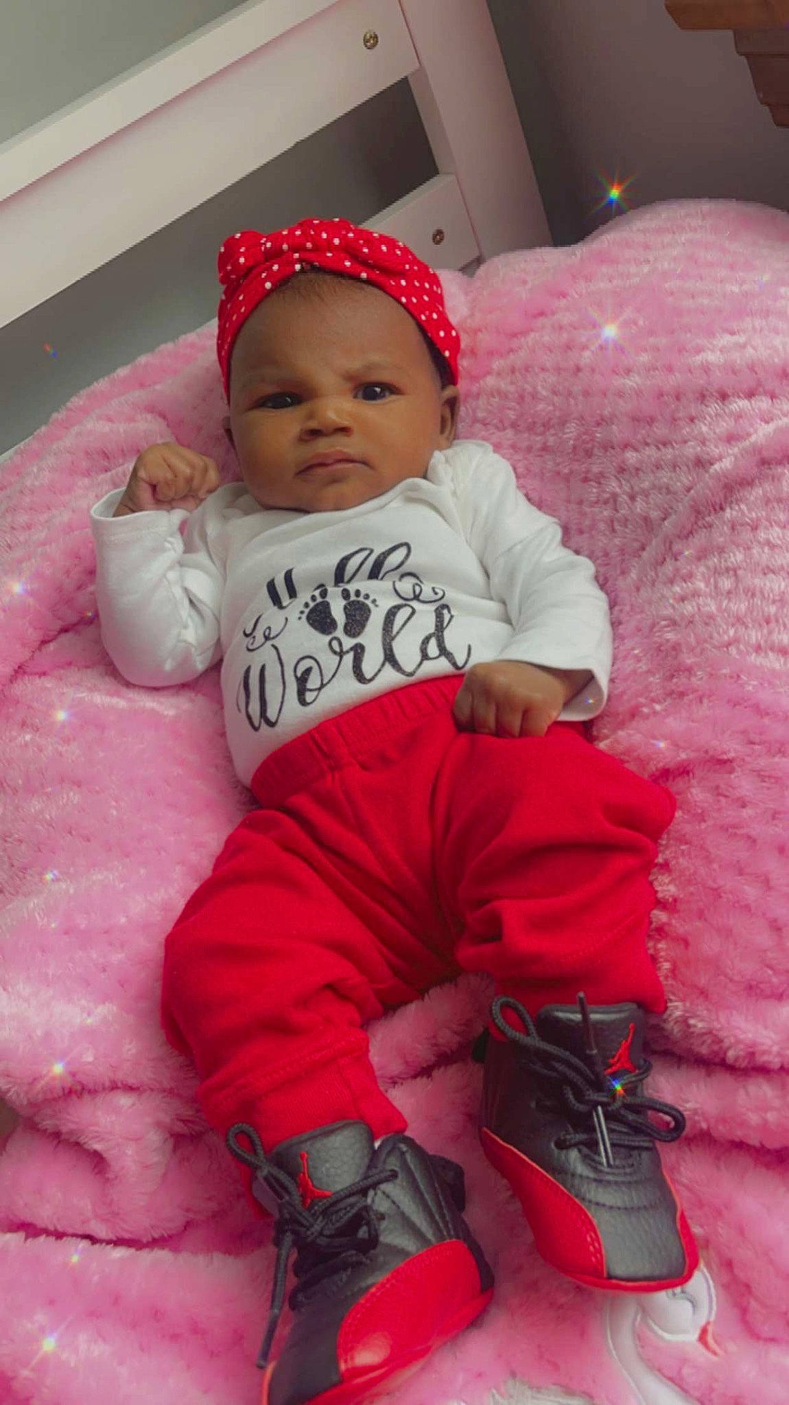 Karlie joined the competition — help win amazing prizes! baby, baby_toddler_clothing, cheek, child, comfort, face, facial_expression, happy, linens, magenta, person, photograph, pink, purple, red, sitting, skin, sleeve, textile, toddler