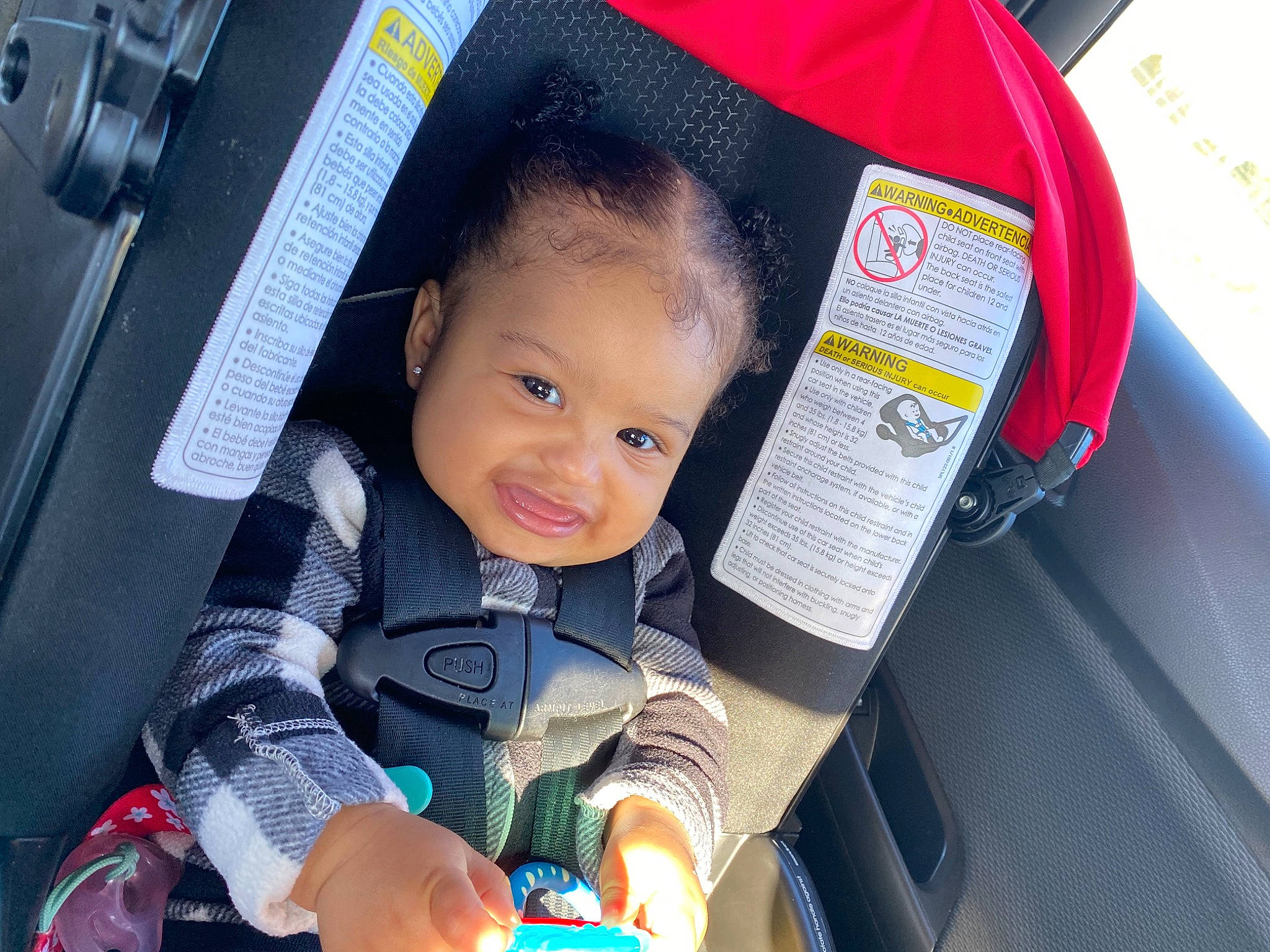 Gia is registered to the contest to win money with this photo: auto_part, automotive_design, baby, baby_carriage, baby_products, blue, car_seat, child, electric_blue, fun, happy, motor_vehicle, person, product, seat_belt, skin, smile, steering_wheel, toddler, travel