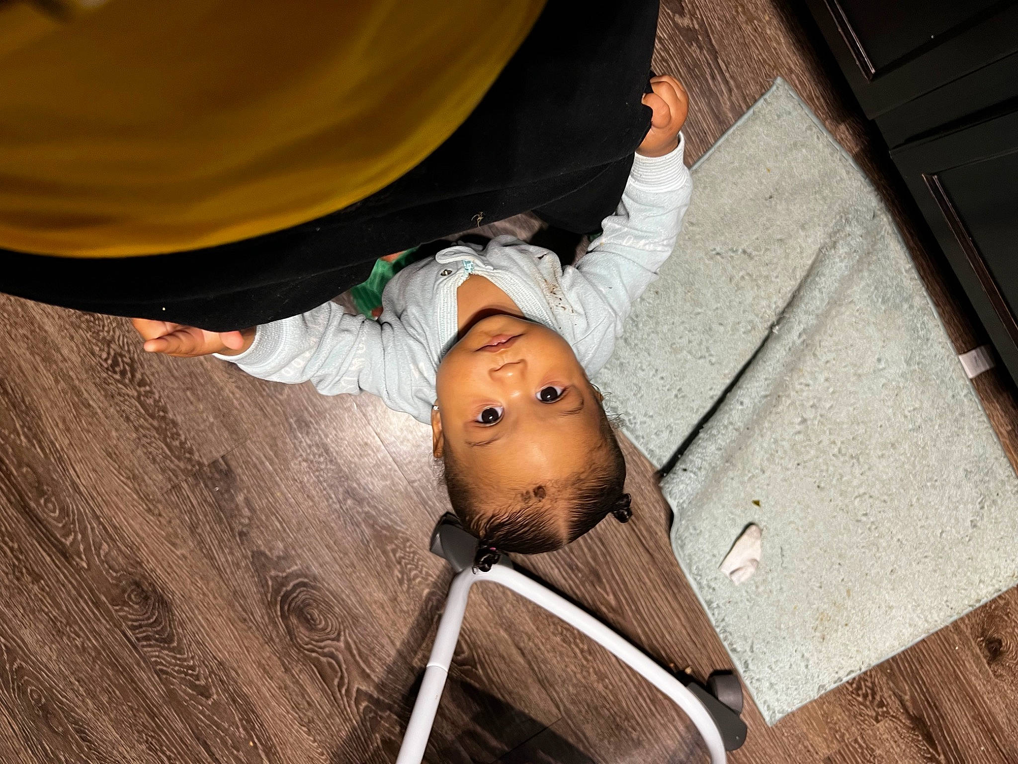 Gia is registered to the contest to win money with this photo: baby, child, comfort, eye, fashion_accessory, flash_photography, floor, flooring, fun, grass, happy, hardwood, headgear, human_leg, leg, nap, person, sitting, toddler, umbrella