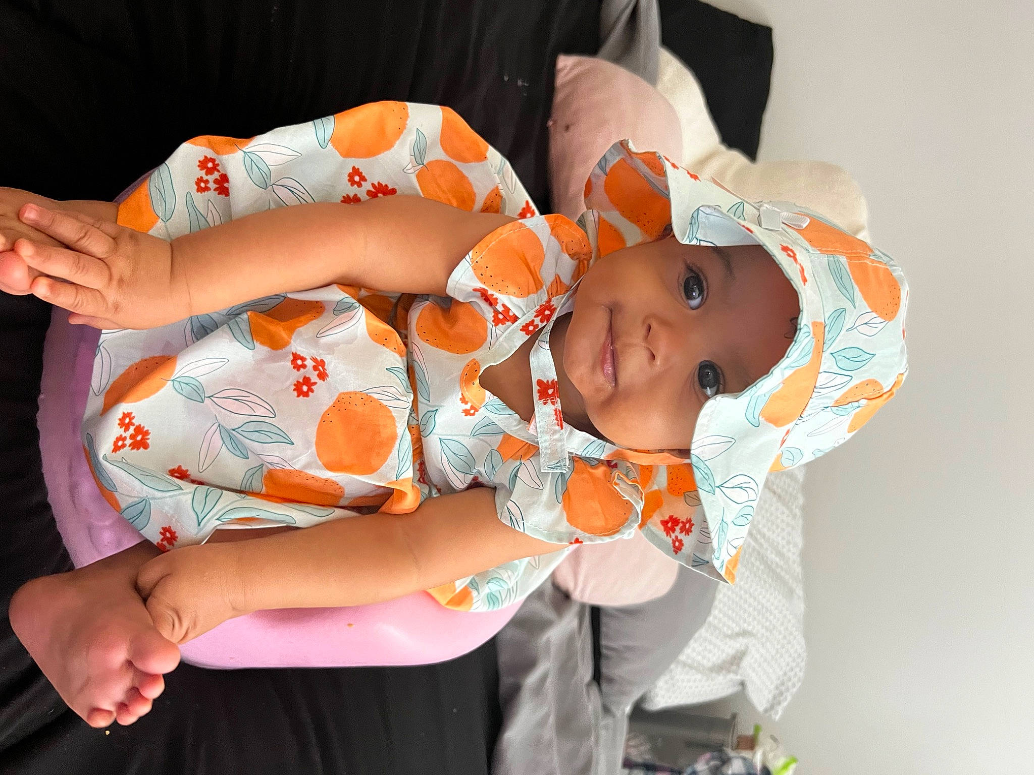 Gia joined the competition — help win amazing prizes! abdomen, arm, baby, baby_toddler_clothing, comfort, elbow, finger, gesture, hand, headwear, human_body, jewellery, mouth, orange, pattern, person, product, skin, thigh, toddler
