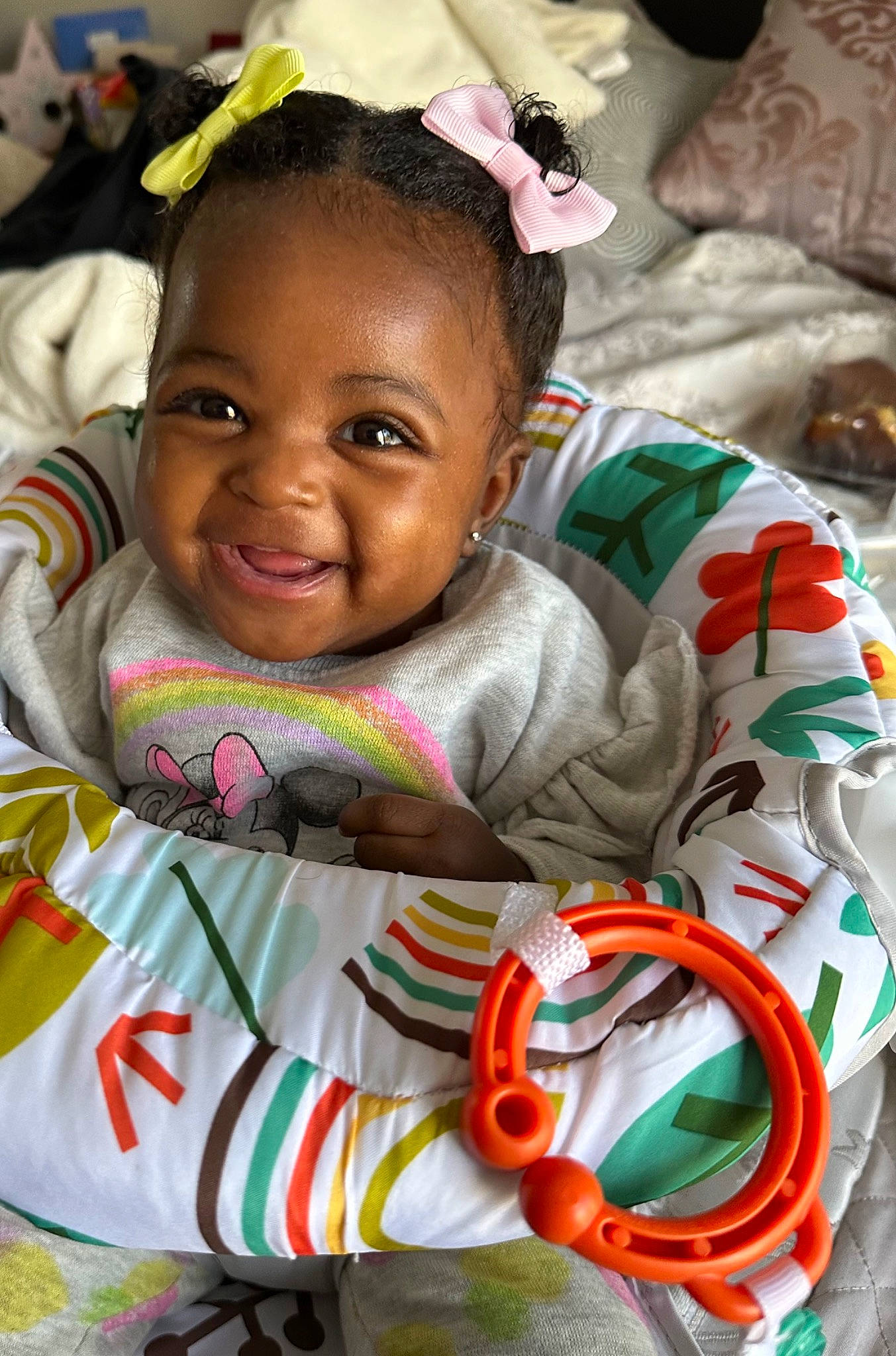 Nova Marie is registered to the contest to win money with this photo: baby, cheek, child, event, eye, face, facial_expression, fun, hairstyle, happy, head, leisure, nose, person, pink, room, sitting, skin, smile, toddler