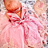 Kylie is registered to the contest to win money with this photo: baby, pink_dress, bow, headband, blanket, infant, delicate, soft_texture, decorative_card, number_three, laying_down, newborn, cute, pastel_colors, lace, sequins, cute_outfit, soft_lighting, indoor, portrait