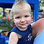 toddler, child, blue_eyes, mohawk, smile, tank_top, outdoor, event, blurred_background, person, freckles, shoulder, holding, face, happy, summer, casual_clothing, daylight, cute, portrait