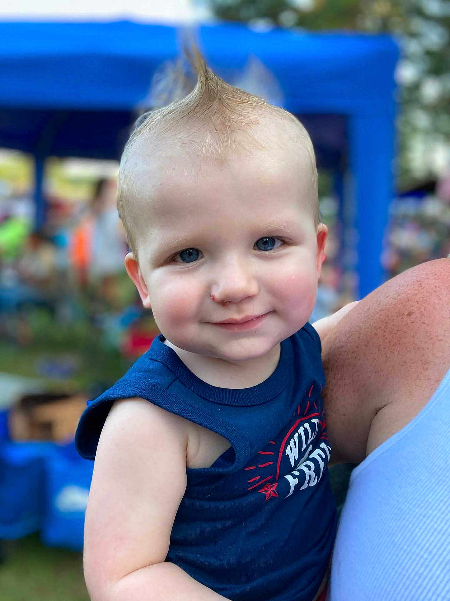Remington joined the competition — help win amazing prizes! toddler, child, blue_eyes, mohawk, smile, tank_top, outdoor, event, blurred_background, person, freckles, shoulder, holding, face, happy, summer, casual_clothing, daylight, cute, portrait
